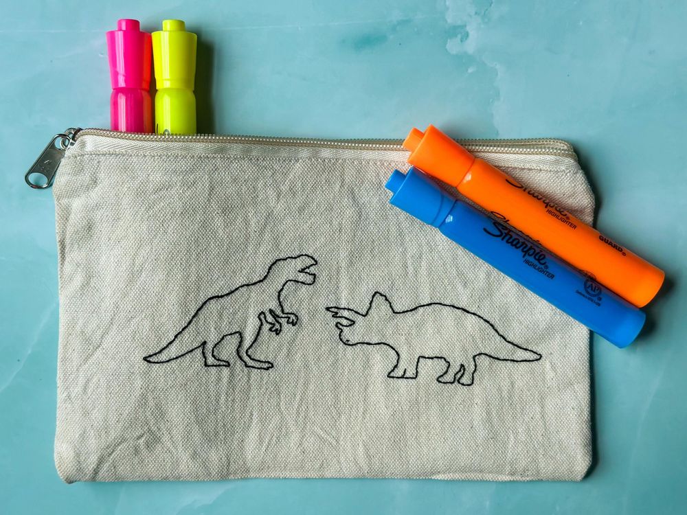 Embroidered Dinosaur Canvas Pouch.